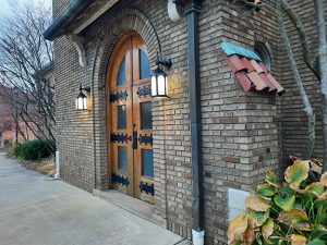 Brick building and large, old, closed door